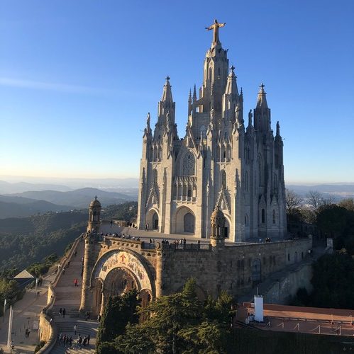 Statue of Christ on top the spires of the Church of the Sacred Heart of Jesus in Barcelona.