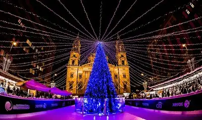Illuminated Christmas tree and ice-rink in Budapest Advent fair.