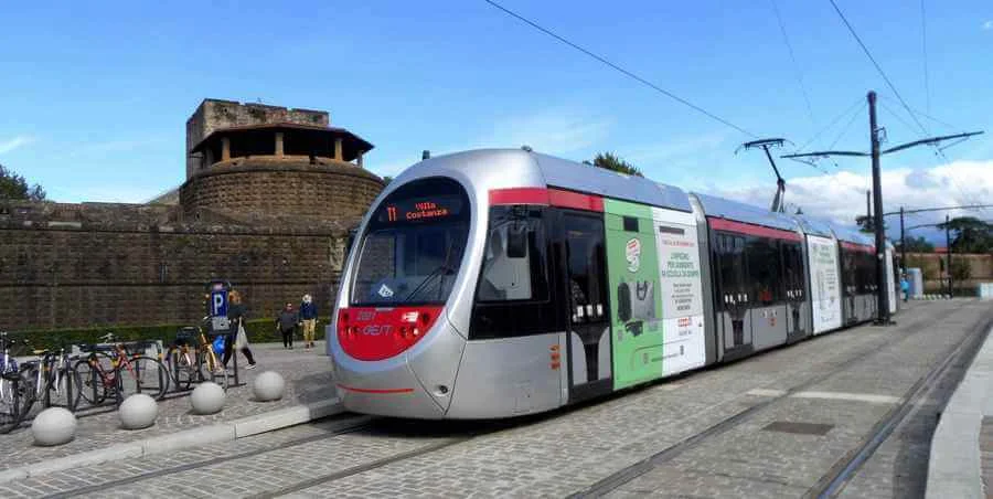 Modern Florence Tram outside the old walls of Fortezza da Basso Fort.