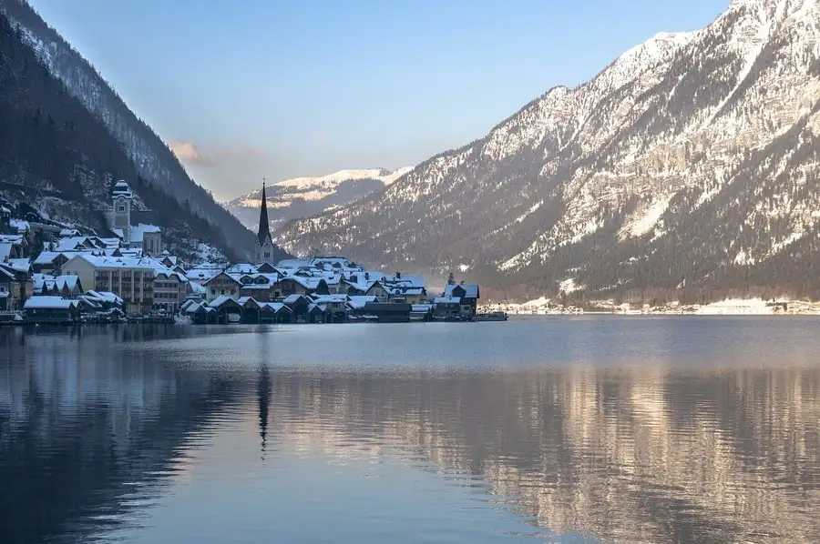 Wintery view of lake to Halstatt and snowy mountains.