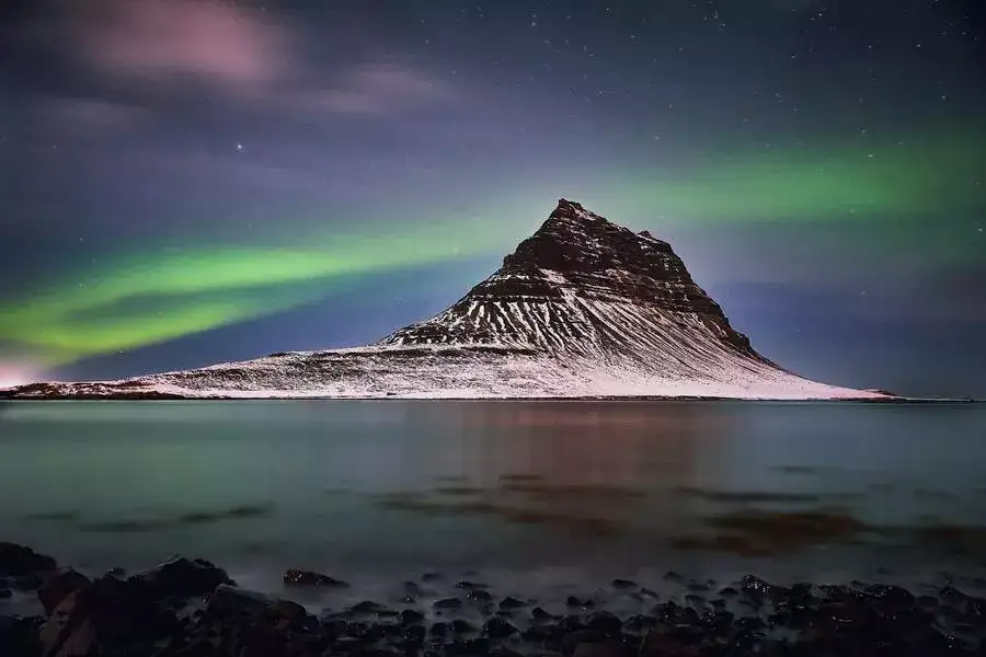 Northern lights over Kirkjufell Mountain.