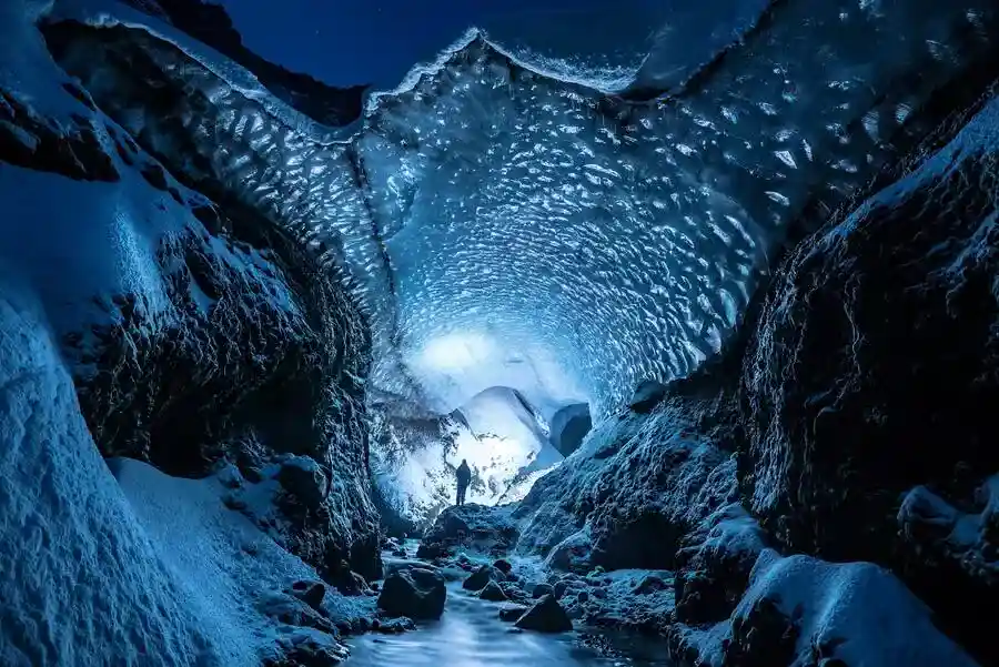 Inside an ice tunnel underneath a glacier in Iceland.