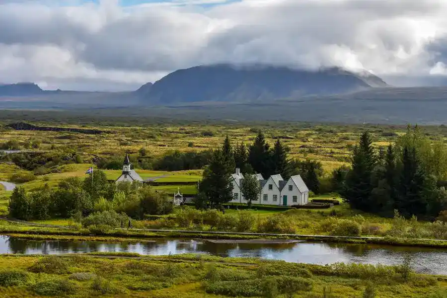 Þingvellir National Park rift valley with a riverside church in summertime.