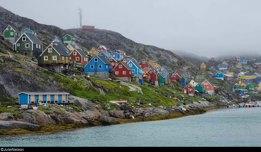 The colourful traditional Greenland houses in Kangaamiut seen from the coastal ferry.