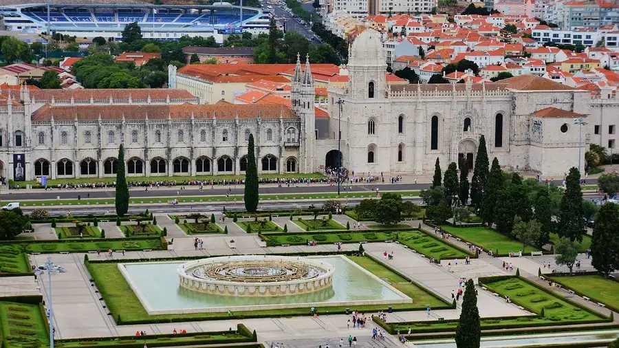 Jeronimos monastery with ornamental gardens in front.
