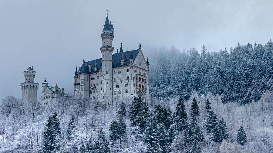 December snowy scene of Neuschwanstein Castle.