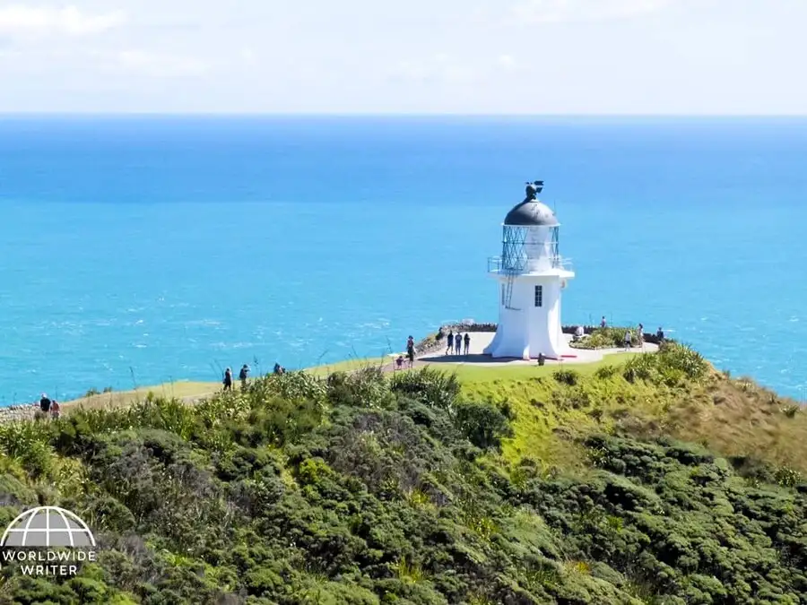 Lighthouse on the cliff at Cape Reinga in New Zealand.