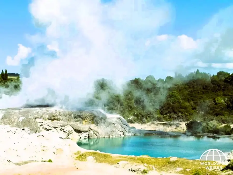 Steam rising from the turquoise pools at the hot springs of Rotorua.