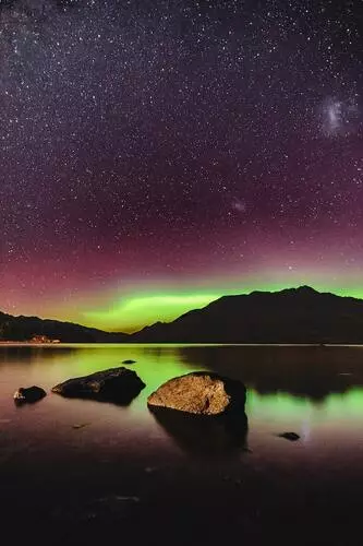 Southern Lights over a lake in South Island New Zealand.