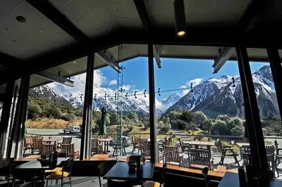 Diningroom of an alpine lodge with views to Mount Cook.