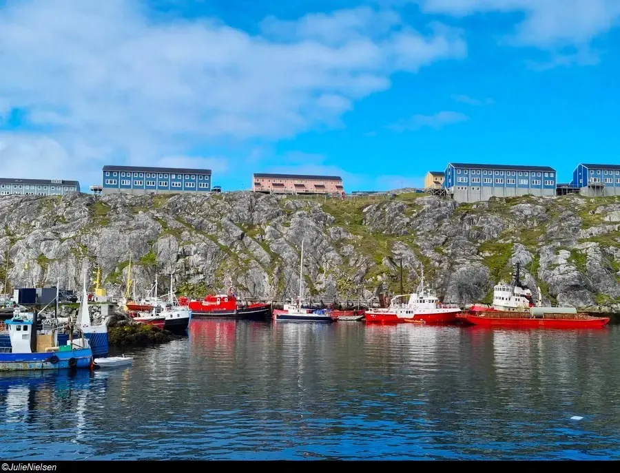 View of the colourful fishing boats in Nuuk harbour from the Greenland coastal ferry.
