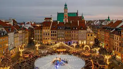 Aerial view of Warsaw Christmas Festival with ice-rink and December lights.