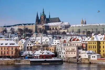 Panoramic winter view of Prague old town across the river.