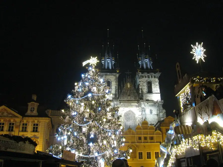 December night scene in Prague old town square with silvery tree and illuminations.