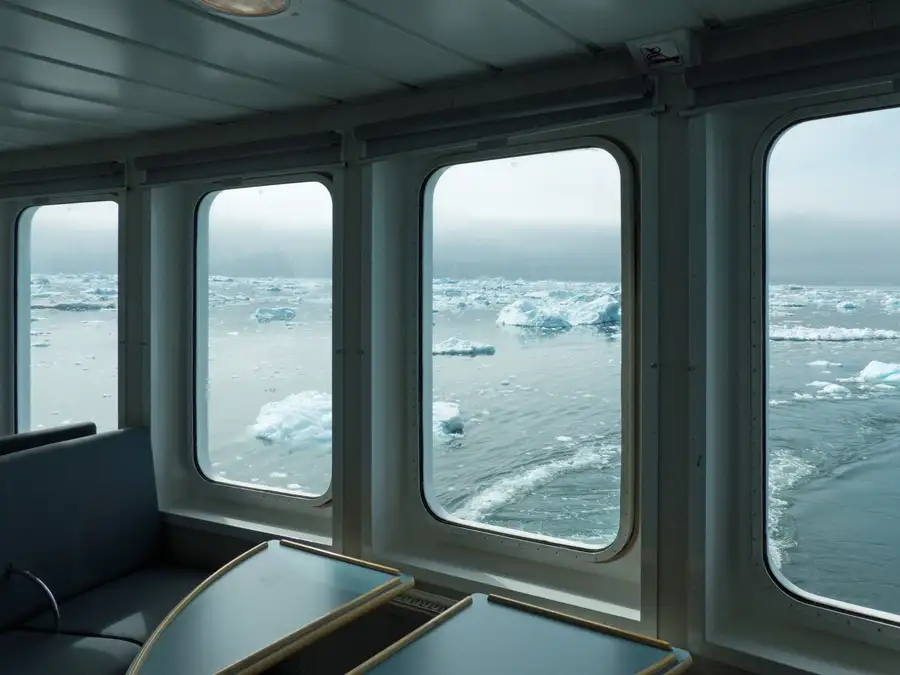 Views of the icy Greenland sea from the windows of the Sarfaq Ittuk panorama lounge.