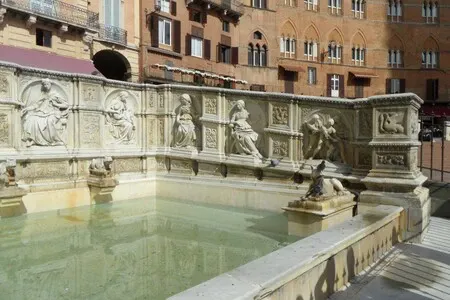 Fonte Gaia is a fountain with marble statues in Siena's medieval town square.