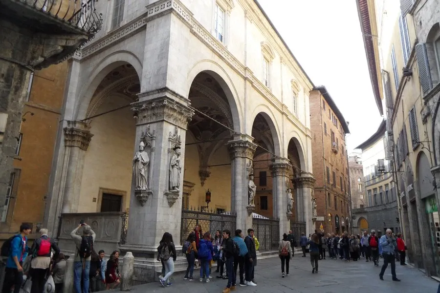Loggia Della Mercanzia on Siena's central walking street Via di Città.