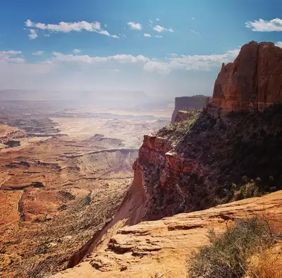 The arid Canyonlands landscape stretches to the horizon.